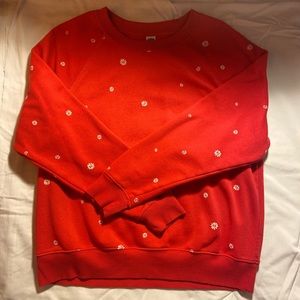 Red pullover with flowers